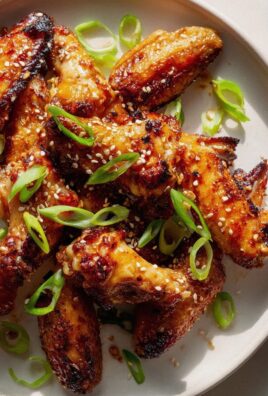 Hot Honey Chicken Wings: Sesam, Frühlingszwiebeln Genuss!